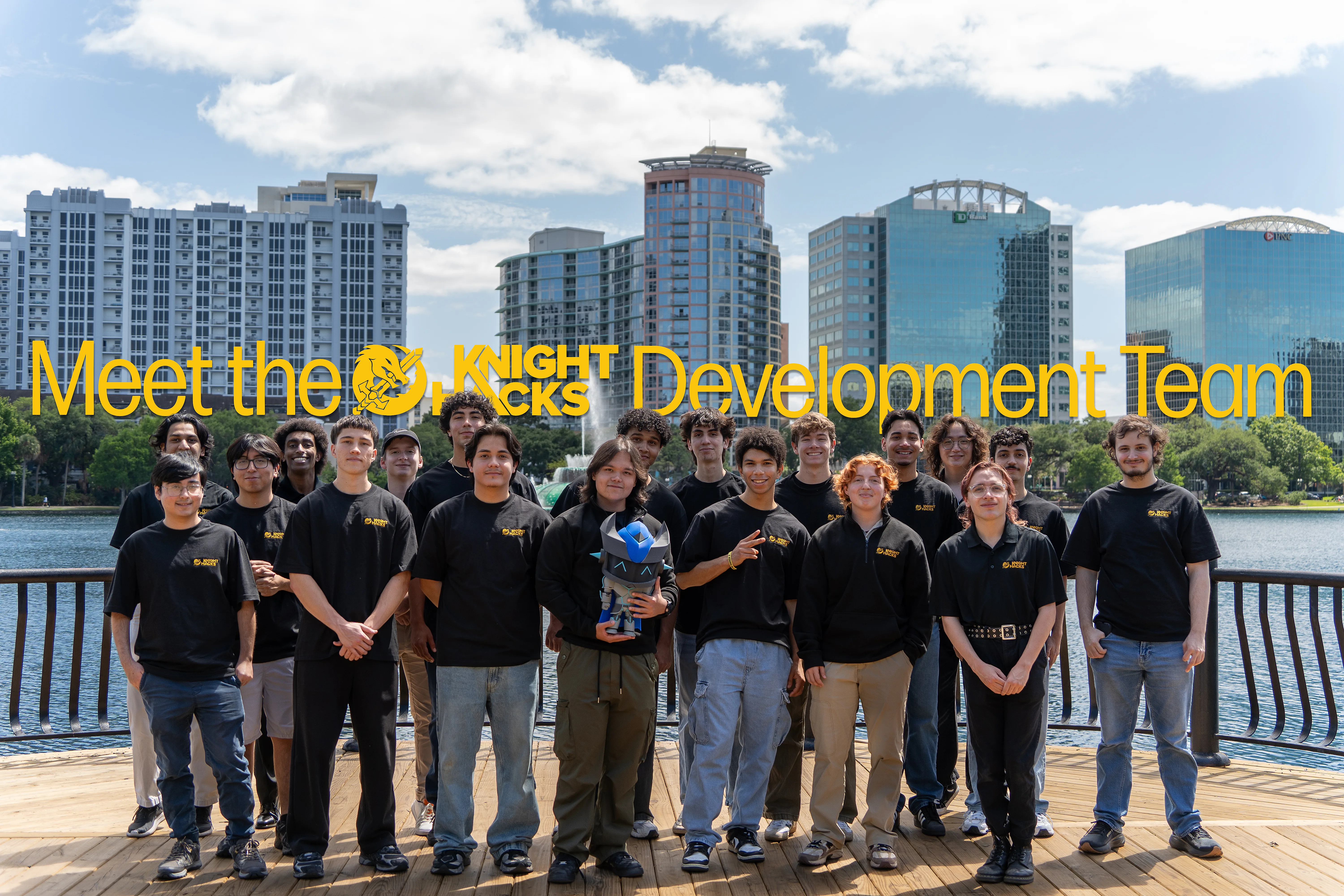 Knight Hacks development team standing together by Lake Eola