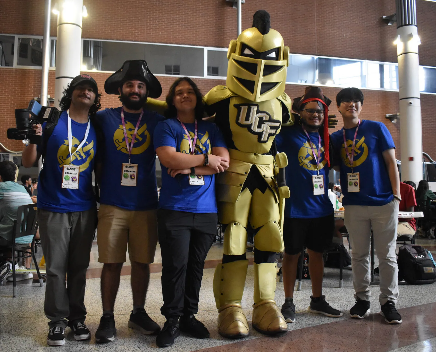 Knight Hacks VII attendees posing with the UCF mascot